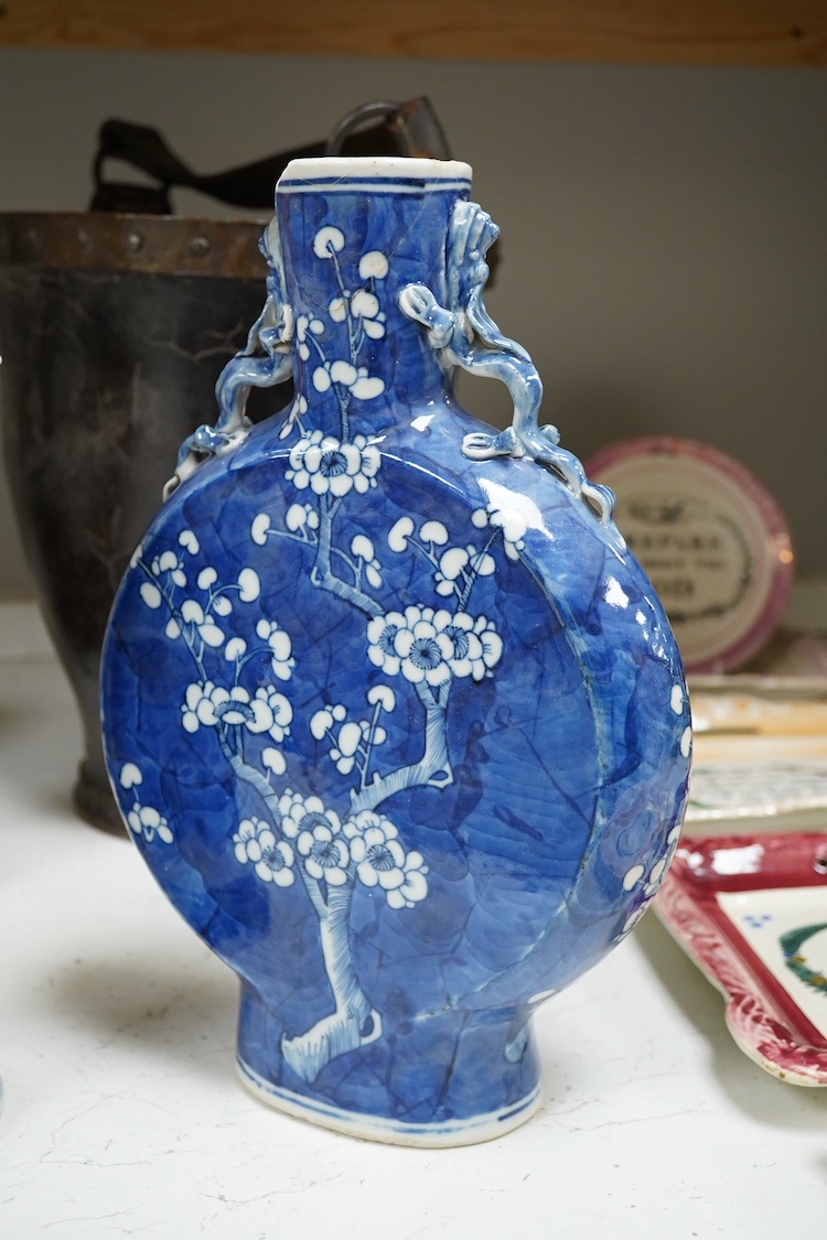 A Chinese blue and white prunus flower moon-flask and a Gu vase, largest 30cm high
